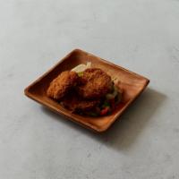 Cod Fritters · Served with ginger, watercress, mint and tomato vinaigrette.