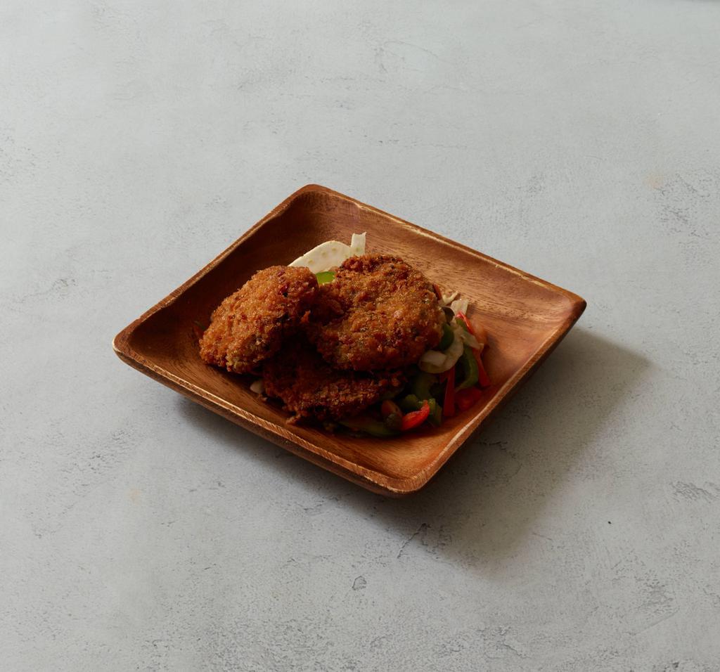Cod Fritters · Served with ginger, watercress, mint and tomato vinaigrette.