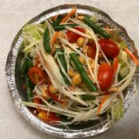Som Tum · Papaya salad. Green papaya, carrots, tomatoes, peanuts and Thai fresh chilies. Available wit...