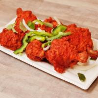 Chicken Lollipop · 6 pieces. Bone in chicken cooked in a homemade sauce sauteed with onions, bell peppers and c...