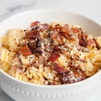 Bacon Mac and Cheese · Our house mac gets tossed and topped with smoked bacon chunks.