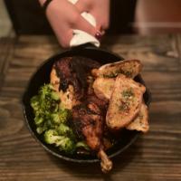 Wood Fire Roasted Half Chicken · Braised brussels sprouts, garlic crostini, chicken jus