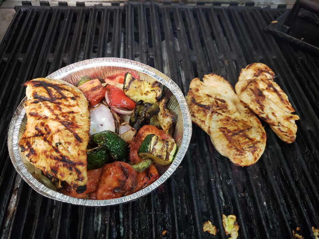 Grilled Chicken Vegtable Plate · Comes with salad, pita bread and tzatziki