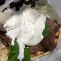Lamb/Beef Gyro  Pita · Traditional Beef and Lamb Gyro. Served with Lettuce, Tomatoes, Onions and Tzatziki Sauce.