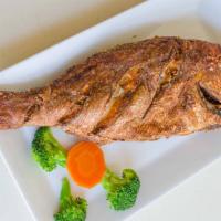 Chillo Entero · Whole 1.5lb Red Snapper. Served with choice of side.