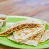 Breakfast Quesadilla · Cooked tortilla that is filled with cheese and folded in half. 