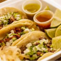 Picadillo Taco · Ground beef with diced potatoes and green sauce.