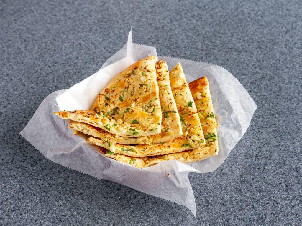 Garlic Naan · Leavened grain bread topped with chopped garlic.