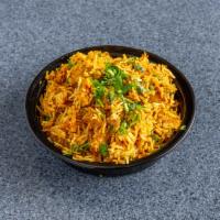 Chicken Biryani · Long grain basmati rice cooked with mild spiced chicken, saffron, nuts and raisins.
