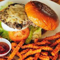 Bayou Burger · Blackened beef patty, lettuce, tomato, pickle, onion, jack cheese and chipotle mayo on a gri...