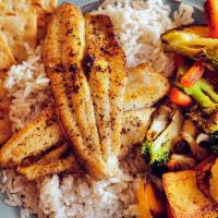 Lemon Pepper Catfish · 2 seasoned fillets, broiled and served on a bed of white rice with mixed vegetables.