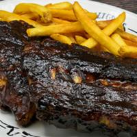 BBQ Baby Back Ribs · Slow-cooked & “fall-off-the-bone.” This item can be prepared gluten sensitive.