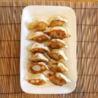 Vegetarian Pan Fried Dumplings (12 pc) · Vegetarian hand made dumplings,  pan fried.