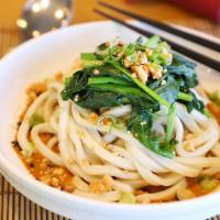 Jeng Chi Spicy Dan Dan Noodle · A spicy peanut & sesame sauce, home made noodles topped with wilted spinach and crushed pean...