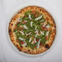 Prosciutto & Arugula Pizza · Extra virgin olive oil, prosciutto di Parma, fresh mozzarella, shaved Parmigiano, tomato, ar...