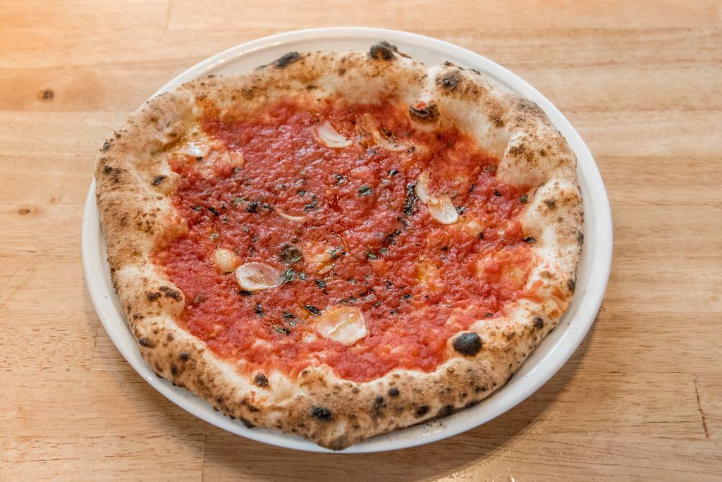 Marinara di Costantino Pizza · No cheese. Tomato sauce, Calabrian chile-infused extra virgin olive oil, slivered garlic, oregano.