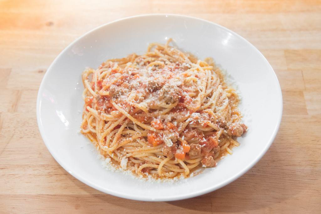 Spaghetti Bolognese · Traditional meat and tomato ragu, spaghetti, grana padano.