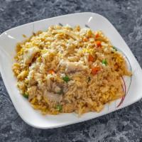 Kow Pad · Fried rice with eggs, white onions, peas and carrots.