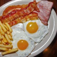 Romo’s Super Breakfast · 2 eggs, ham, bacon, toast, fries and cafe con leche.