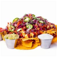 *Tapchos* · Fresh cut house chips smothered with grilled BBQ chicken, jalapeños, pico de gallo, jack and...