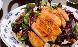 Berry Chicken · Organic greens tossed in a blackberry vinaigrette, candied walnuts, and craisins. Topped with bleu cheese, crumbles, and grilled chicken.