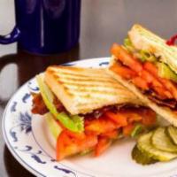 Oswald Greens BLT Sandwich · Pepper bacon, lettuce, and sliced tomato with a herb garlic mayonnaise served on your choice...