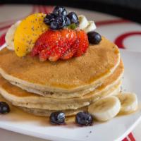 57. Chia Cakes · Multi-grain chia seed pancakes topped with fresh fruit and served with sugar free syrup.