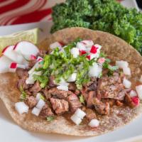 17. Grass-Fed Steak Taco · Served with fresh cilantro, onion, lime and radish. 