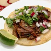 21. Lean Beef Barbocoa Taco · Served with fresh cilantro, onion, lime and radish. 