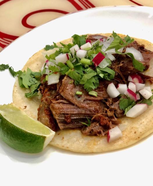 21. Lean Beef Barbocoa Taco · Served with fresh cilantro, onion, lime and radish. 
