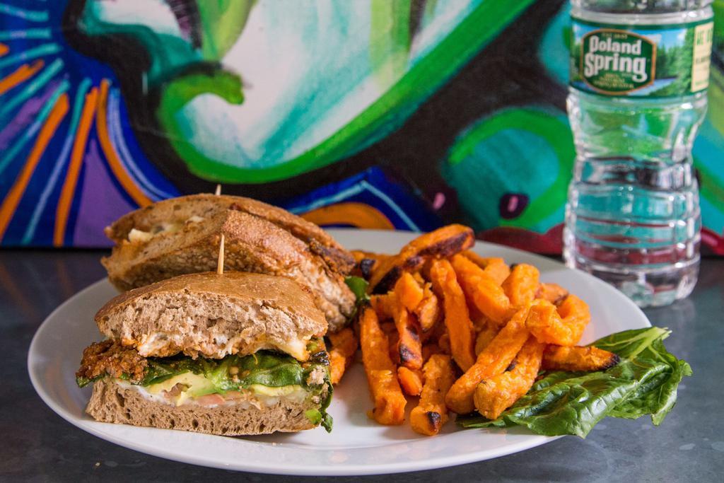 27. Grande Turkey Chorizo Torta · Pressed Mexican sandwich served on a whole wheat with pepper jack, avocado, pickled jalapeno, lettuce, tomato and low fat sour cream. Served with choice of side and water bottle.