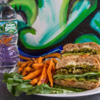 28. Grande Cactus Torta · Pressed Mexican sandwich served on a whole wheat with pepper jack, avocado, pickled jalapeno...