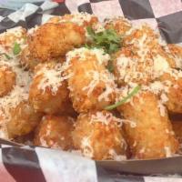 Truffle Tots · White truffle oil and Atwell's gold cheese. Gluten free.