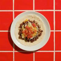 Soft Taco · Soft flour tortilla, tomato, shredded cheese, lettuce, and choice of meat.