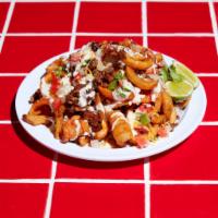 Tiki Fries · Choice of protein, curly fries, shredded cheese, fresco cheese, sour cream, pico, and Queso.