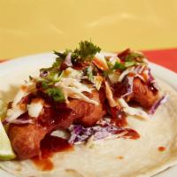 Thai Fried Chicken Taco · All white meat chicken tempura hand battered to order. Sour cream, purple cabbage, and jalap...