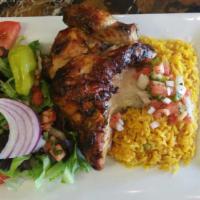 1/2 Peruvian Chicken Combo · 1/2 Peruvian BBQ chicken rice and salad.
