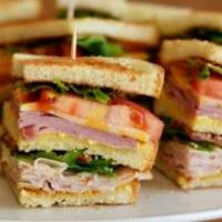 Club Sandwich · Ham, American cheese, turkey, Swiss cheese, lettuce, tomatoes, bacon, mayo.

