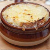 French Onion Soup · Caramelized sweet and red onion soup with Jason's recipe top with provovlogne cheese.