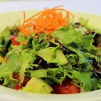 Maison Salad · Ginger, mixed greens, tomato, cucumber and carrots.