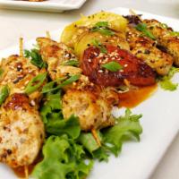 Chicken Yakitori · 4 mini chicken breast skewars in a teriyaki glaze with parsley and sesame seeds