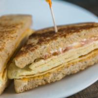 Sunrise Sandwich with Meat · Scrambled eggs, cheddar, tomato and mayo.