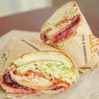19. Going Home for Thanksgiving Sandwich · Turkey, cranberry, Sriracha and havarti. Served hot.