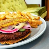 Vegan Falafel Burger · Chickpea falafel, pickled onion, cucumber, lettuce, hummus, on plantain tostone. Gluten Free...