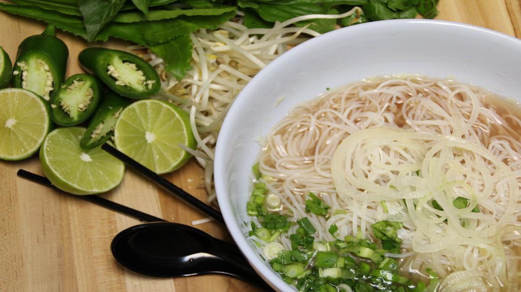 Build Your Noodle Soup · Choose your meat and greens.  Flat rice noodles in beef/chicken broth with toppings; garnished with yellow onions, scallions, cilantro, culantro; served with a side of basil, bean sprouts, lime wedge, and jalapeno peppers.