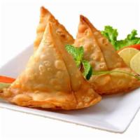 1. Two Pieces Chicken Samosa · India's most popular snack pastry with a filling of minced masala chicken.