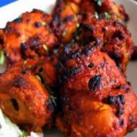3. Chicken Tikka · Tender pieces of chicken breast marinated in mild creamy spices and grill in a clay oven.