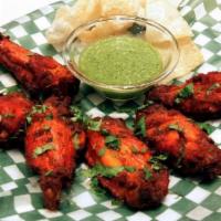 11. Masala Wings · Chicken wings with a vindaloo (spicy!) sauce.
