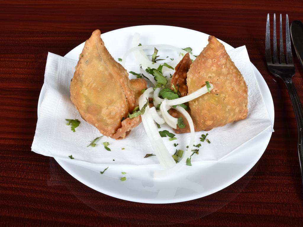 17. Vegetable Samosa · India's most popular snack - pastry with a filling of masala peas and potatoes.
