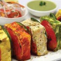22. Tandoori Vegetable Platter · Marinated vegetables and paneer grilled in tandoori oven. Spicy.